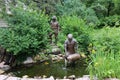 The statue of workers releasing small fish at D.C. Booth Historic National Fish Hatchery