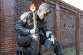 A statue of a world war two soldier with a poppy attached to his rifle Royalty Free Stock Photo