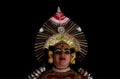 Statue of Yakshagana dace artist on black background. Yakshagana is a traditional folk dance of India