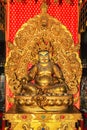 Yellow Dzambhala statue at Buddha Tooth Relic Temple, Singapore Royalty Free Stock Photo