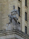 Statue of a young man on stalinist skyscraper in Kudrinskaya square.