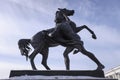 Statue of the young man, taking the horse by the bridle by Peter Clodt in Anichkov bridge. Sunny day view.