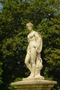 Statue of a young noble man in the gardens of the castle of Chantilly