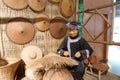 Statue of Zhuang woman weave straw rain clothes in Anthropology Museum Of Guangxi, adobe rgb Royalty Free Stock Photo