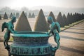 Statues against the backdrop to the garden of the Palace of Versailles Royalty Free Stock Photo