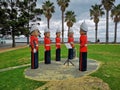 Statues of the Baywalk Bollards in the park in Geelong, Australia with greenery around across lake