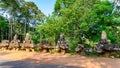 Statues on bridge to Angkor Thom, Cambodia. Demons fallen apart on Temple of Angkor Thom, Cambodia. Royalty Free Stock Photo