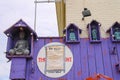 Statues of Buddha and Chinese sages decorating wooden wall in Zandvoort, the Netherlands