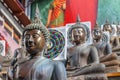 Statues of the Buddha in the lotus position, Gangaramaya Buddhist Temple, Colombo, Sri Lanka Royalty Free Stock Photo