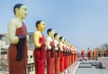 Statues of buddhist saints on the roof of the temple in Colombo