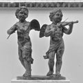 Statues of cherub musicians Royalty Free Stock Photo