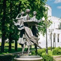 Statues depicting three graceful ballerina dancing in the park near the building of the National Academic Bolshoi Opera