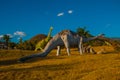 Statues of dinosaurs in the clearing. Prehistoric animal models, sculptures in the valley Of the national Park in Baconao, Cuba.