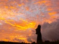 Statues of Easter Island in the background of the sunset. melting of the Easter statue in the sunlight of the sunset Royalty Free Stock Photo