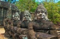 Statues in the entrance to the ancient city of Bayon in the Angkor Wat temple complex near Siem Reap, Cambodia. Royalty Free Stock Photo