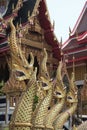 Statues of four strong serpents in a temple Royalty Free Stock Photo