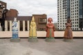 Statues of four women, symbols of the seasons, in Russian national costumes in front of the Siberian State Institute of Arts on st