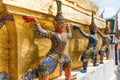 Statues of guards at Temple of Emerald Buddha in Bangkok