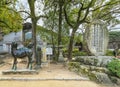 Statues of a Kirin and Uso birds dedicated to Sugawara no Michizane aside a death poem stele in Dazaifu shrine. Royalty Free Stock Photo