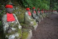 Statues of Ksitigarbha bodhisattva Jizo with red caps and bibs in Nikko, Japan