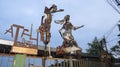 Statues of a man and a woman made by recycled metals