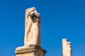 Statues of mythological heroes in Ancient Agora, Athens, Greece. View of big majestic statues on blue sky background in Athens