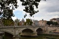 Statues on the Ponte Vittorio Emmanuele II with the Saint Peters Basilica in the Background - Rome, Italy