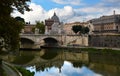 Statues on the Ponte Vittorio Emmanuele II with the Saint Peters Basilica in the Background - Rome, Italy