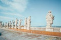 Back view of eleven statues of the saints apostles on the top of St Peter Basilica roof,Vatican City, Rome, Italy Royalty Free Stock Photo