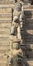 Statues on the steps of an ancient temple in Bhaktapur, Nepal Royalty Free Stock Photo