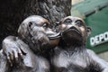 Statues three wise monkeys and big gorilla at a Antique store shopping street in Cologne Royalty Free Stock Photo