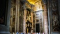 Statues on the top of Saint The interior of Saint Peter Basilica in Rome, Italy