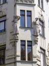 Statues of women on the side of windows to Prague in Czech Republic.