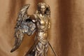 Statuette of the Archangel Michael on a velour background