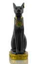 Statuette of black egyptian cat with gold on white Royalty Free Stock Photo