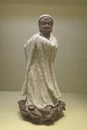 statuette of dharma with exposed porcelain and ge klin-style glaze