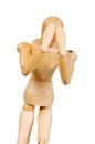 Statuette figure wooden man human makes shows experiences emotional action on a white background. Royalty Free Stock Photo