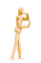 Statuette figure wooden man human makes shows experiences emotional action on a white background. Royalty Free Stock Photo