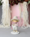 Statuette of a little Valentine. Toy gentelmen. Valentines day concept. Cute enamored boy fiigurine