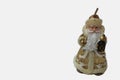 Statuette of Santa Claus on a white background. Golden santa claus candle isolated on white. Saint Nicholas in beige color with a Royalty Free Stock Photo