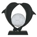 Statuette of two black dolphins with a white soccer ball between them on an isolated background. 3d rendering