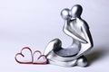 Statuette valentine with hearts Royalty Free Stock Photo