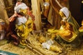 Statuettes of Mary, Joseph and the newborn baby Jesus in the hay, A Christmas crib Royalty Free Stock Photo