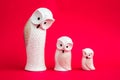 Statuettes of White Owls on Pink Background Royalty Free Stock Photo