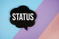 Status text on speech bubble top view on blue, purple and pink geometric background Royalty Free Stock Photo