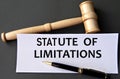 STATUTE OF LIMITATIONS - words on white paper on dark background with judge\'s gavel