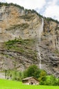 Staubbach waterfall with chalet in front - Lauterbrunen, Switzerland