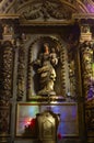 Staue of the holy Mary holding the baby Jesus Christ inside the gothic Cathedral of Saint-andrÃÂ©