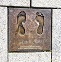 STAVANGER, NORWAY - JULY 09, 2015: Bronze cast of bare feet of Desmond Mpilo Tutu, Nobel Peace laureate in Stavanger, Norway.