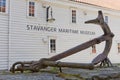 An old anchor displayed in front of Stavanger Maritime Museum entrance in Stavanger Norway